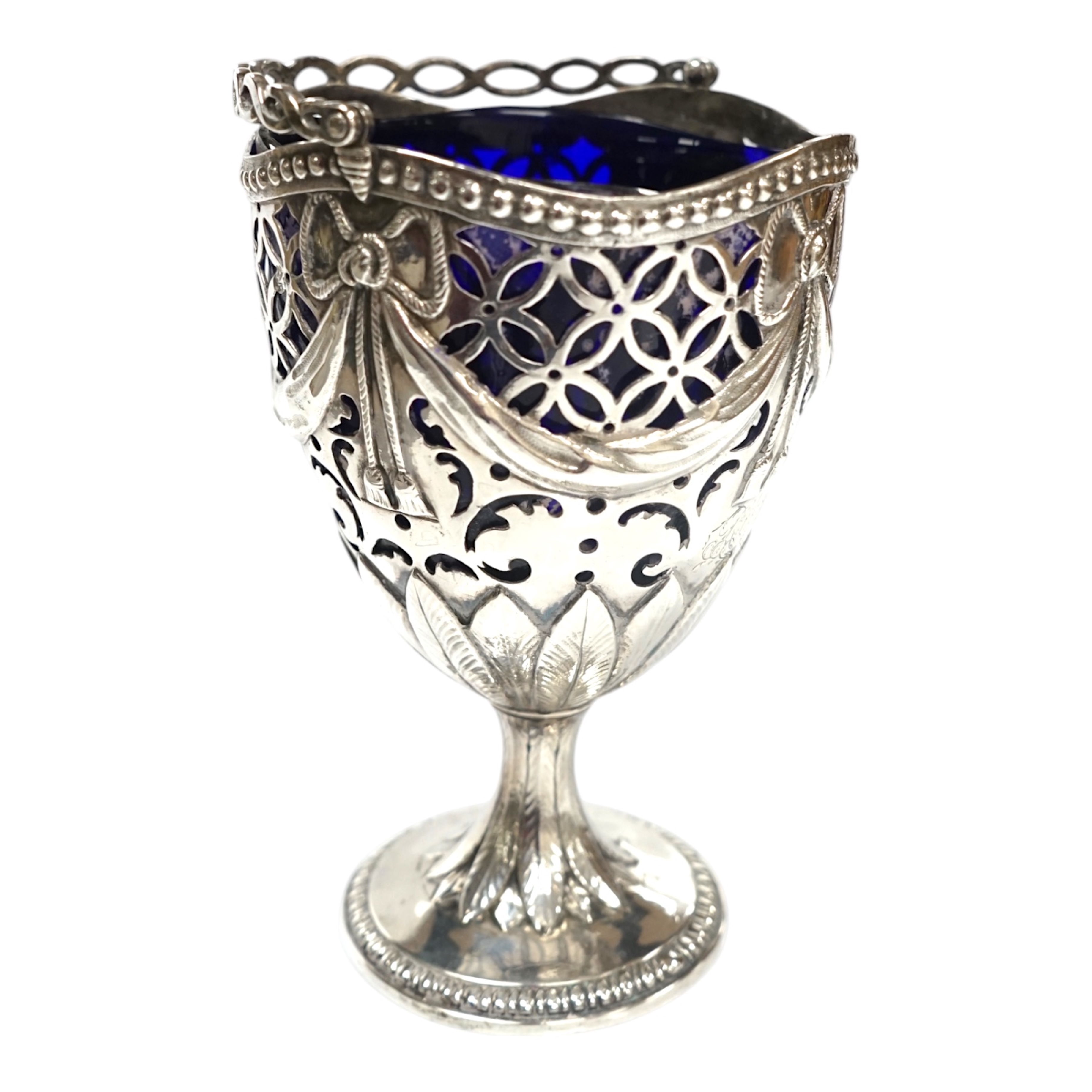 A George III silver pedestal sugar basket, with blue glass liner, indistinct marks, height 12.4cm. Condition - fair